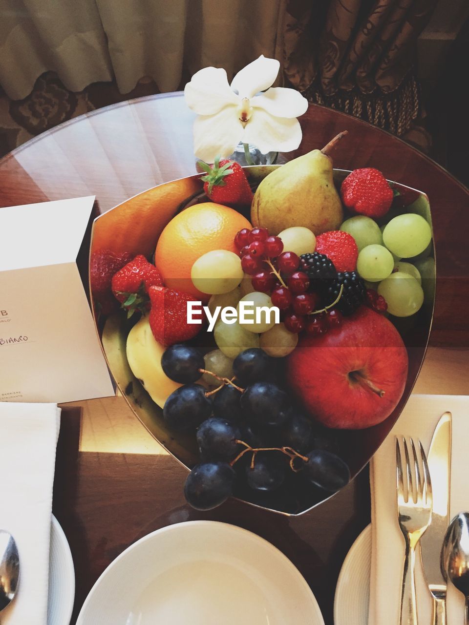 High angle view of fresh fruits in container on table