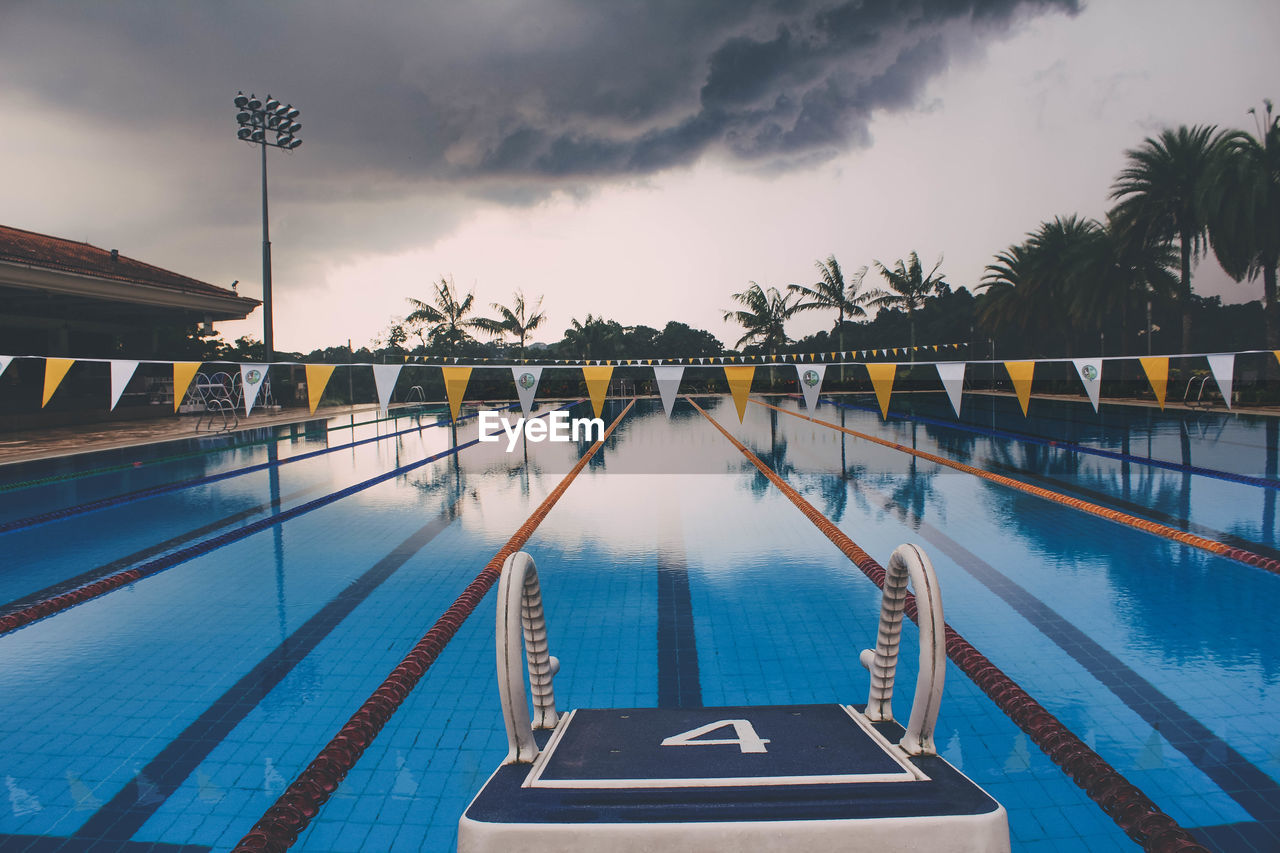 View of starting block by swimming pool