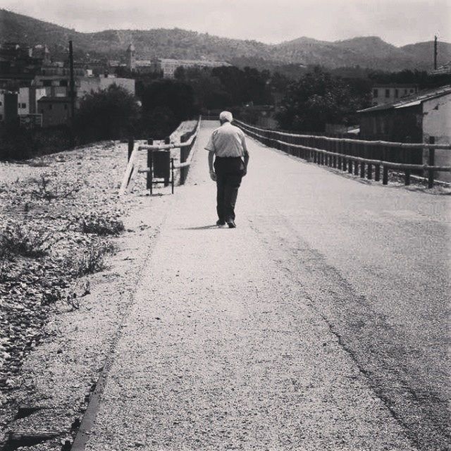 Rear view of senior man walking
