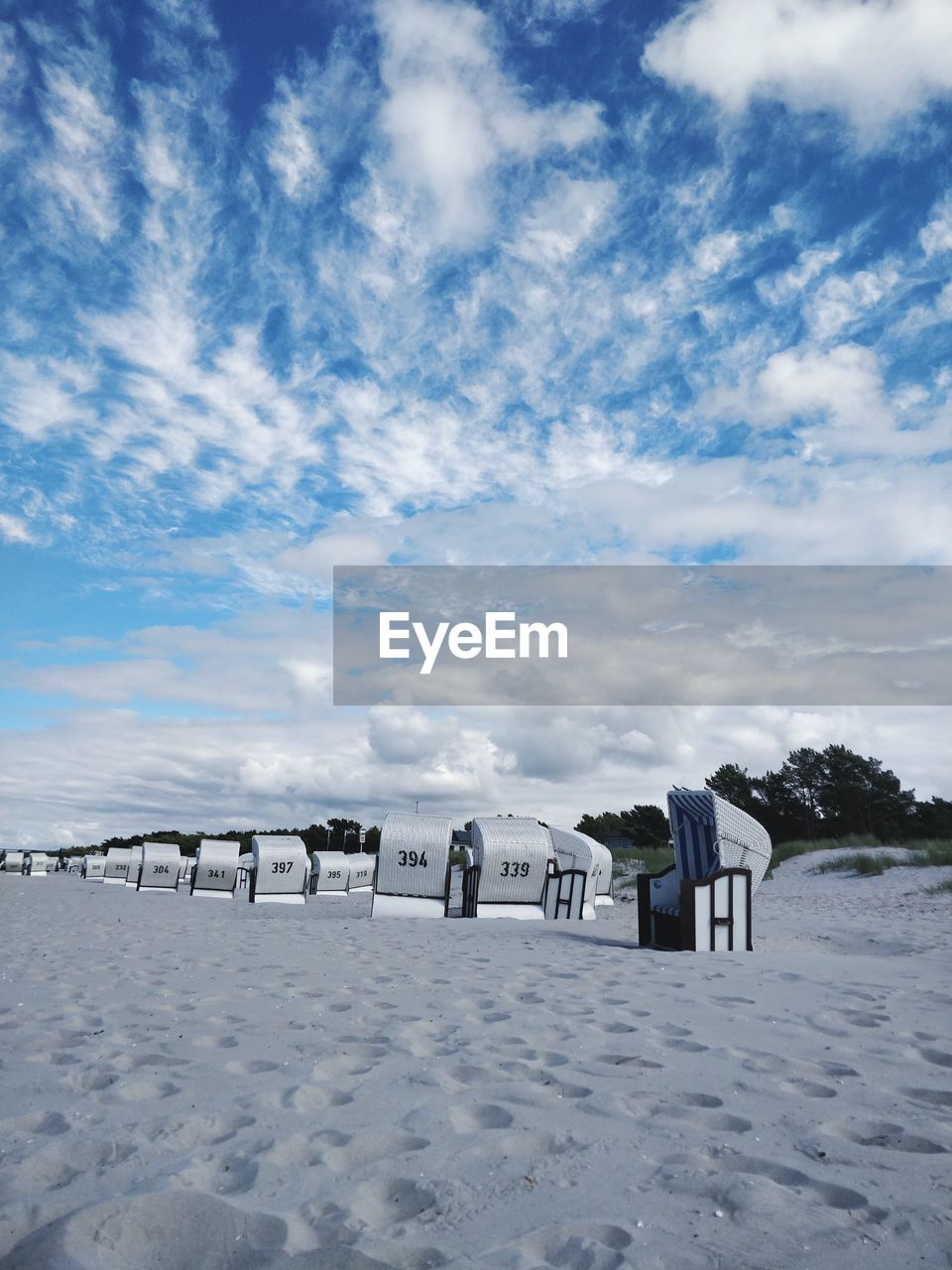 Scenic view of beach against blue sky