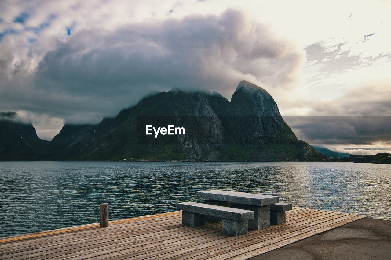 PIER ON LAKE AGAINST SKY