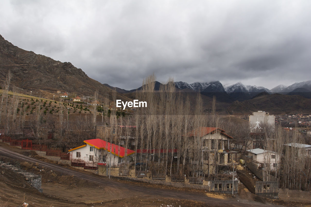 PANORAMIC VIEW OF BUILDINGS AGAINST SKY