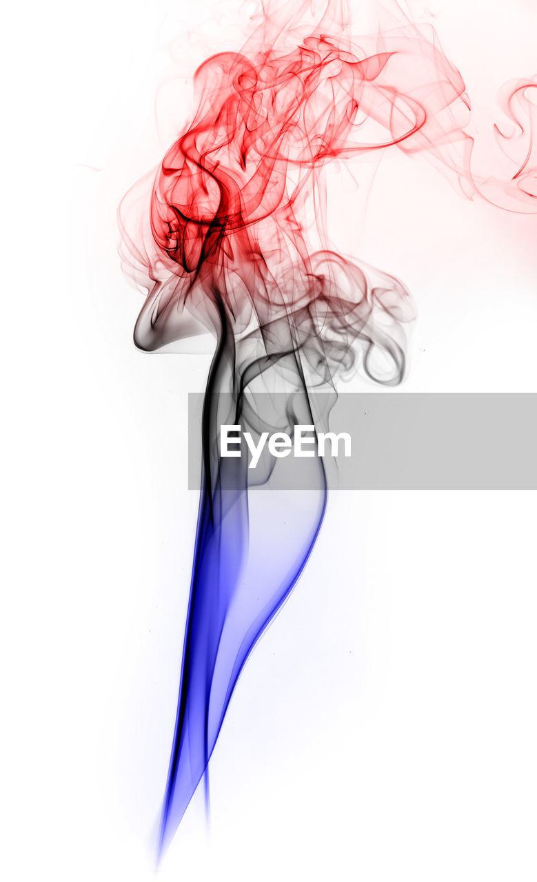 Colorful smoke against black background
