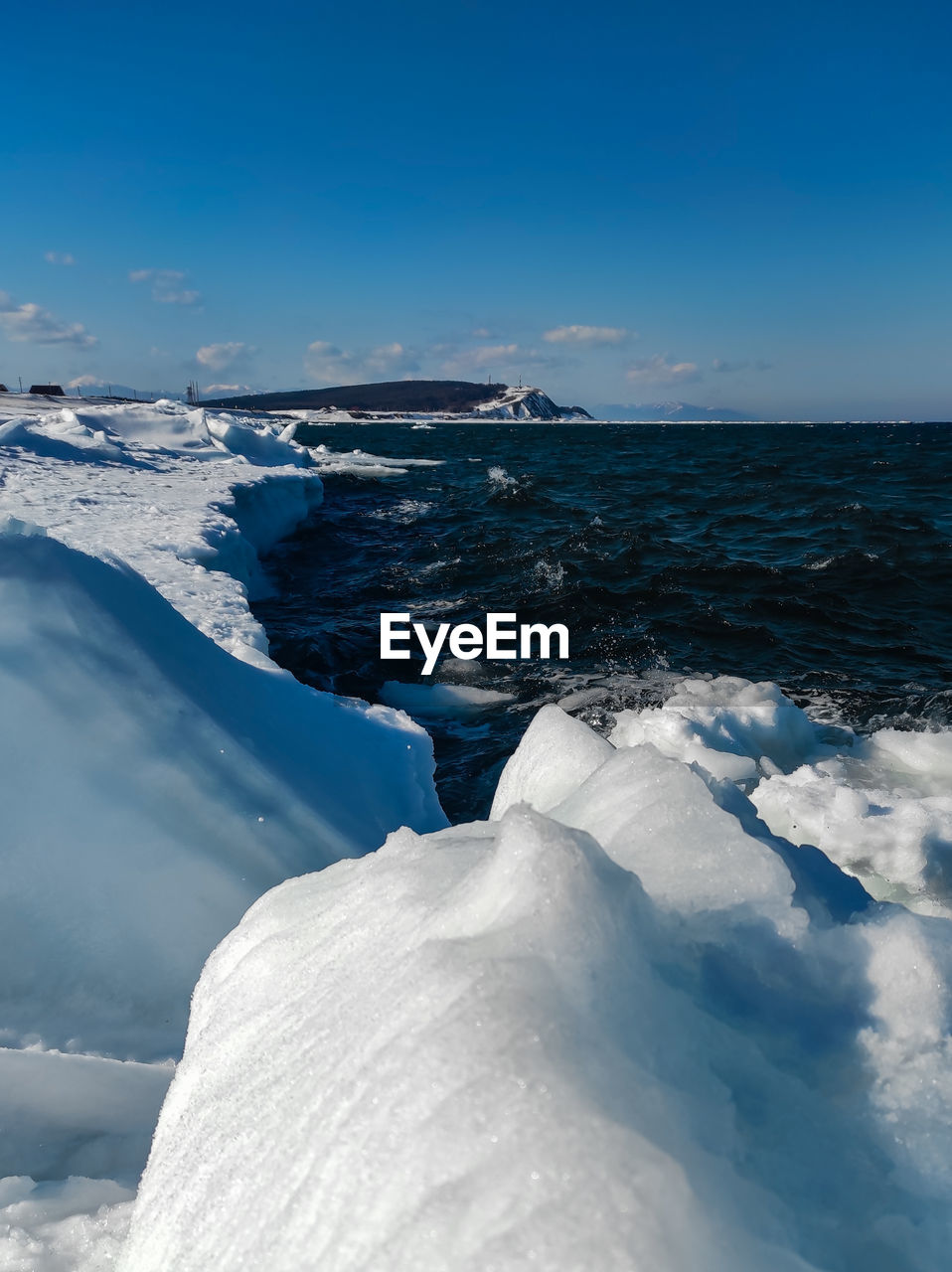 Scenic view of sea against sky during winter