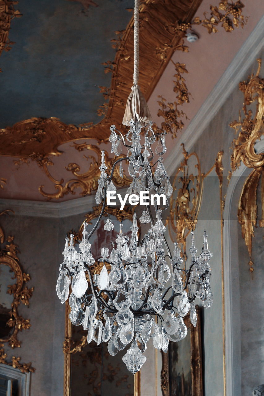 LOW ANGLE VIEW OF DECORATION HANGING ON CEILING IN BUILDING