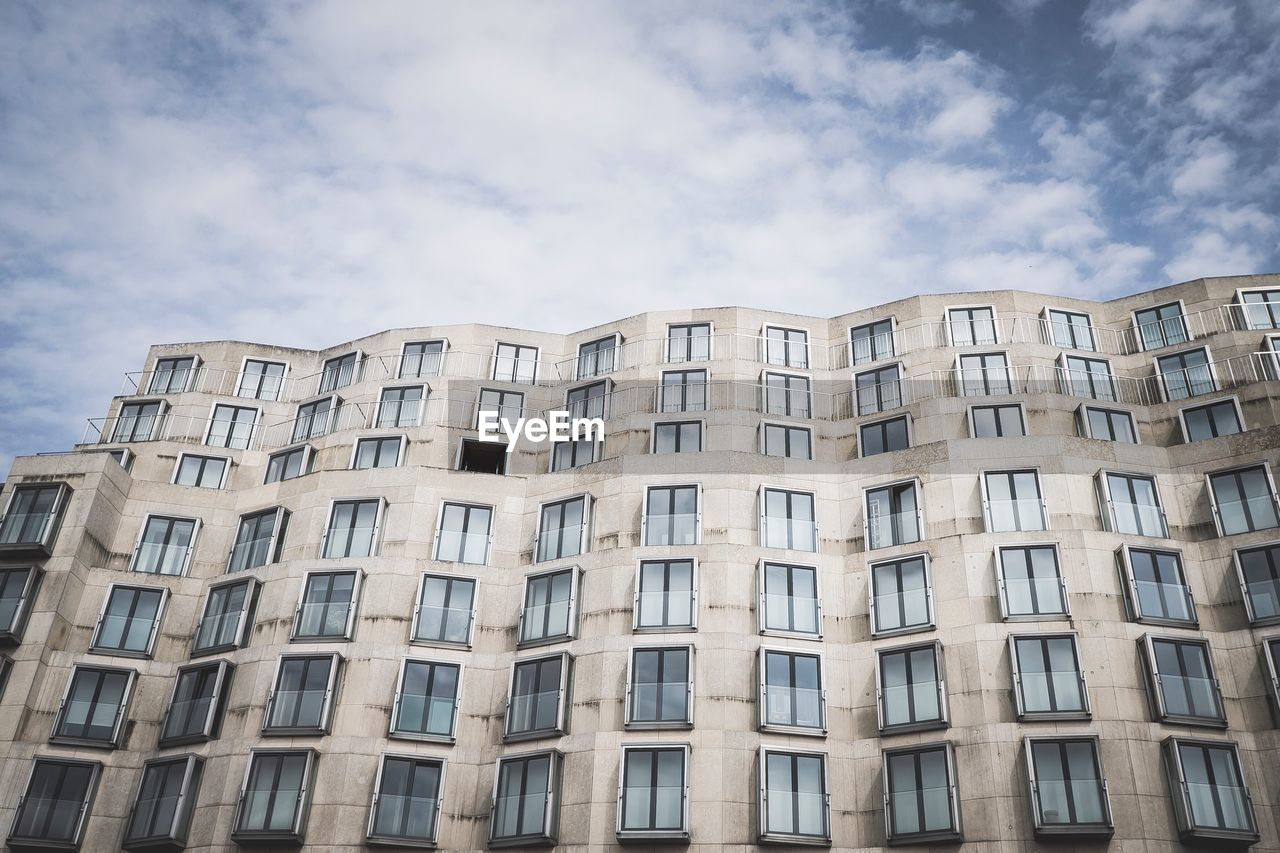 LOW ANGLE VIEW OF RESIDENTIAL BUILDINGS AGAINST SKY