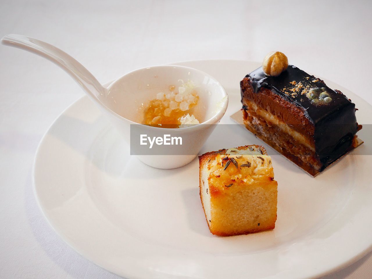 Close-up of dessert served in plate on white background