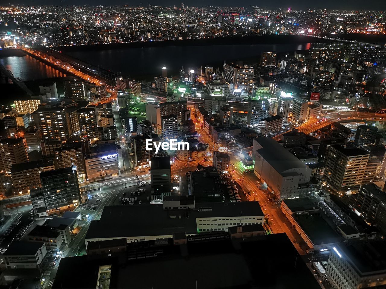 High angle view of illuminated buildings in city at night