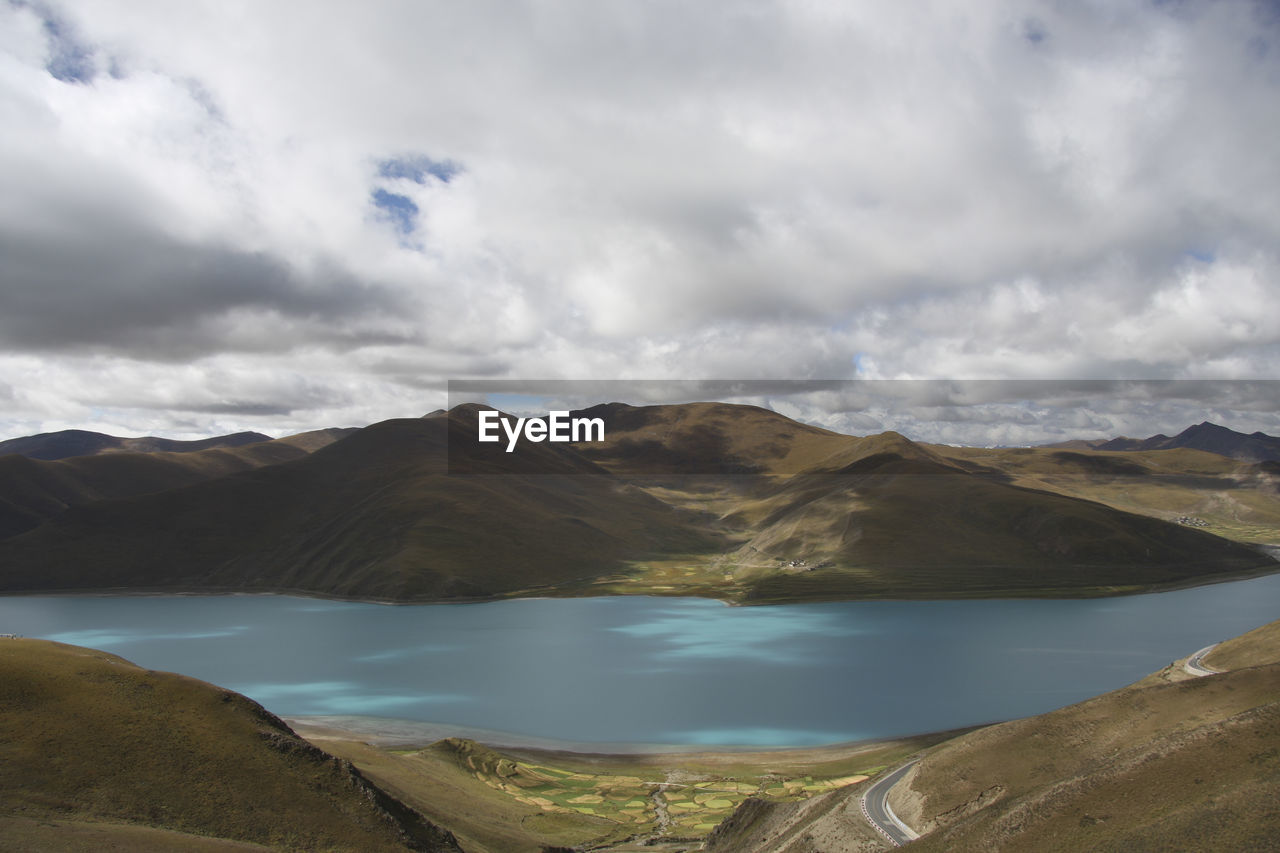 Scenic view of lake and mountains against sky