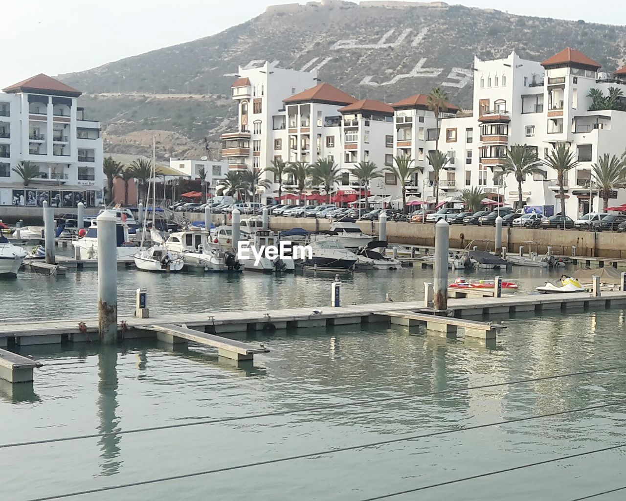 BOATS MOORED IN HARBOR