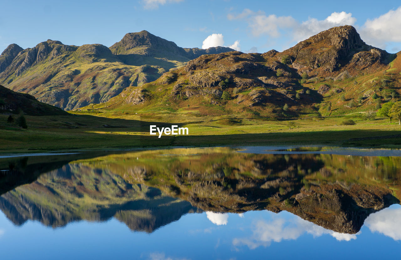 Reflections of the langdales in blea tarn in the english lake district, uk