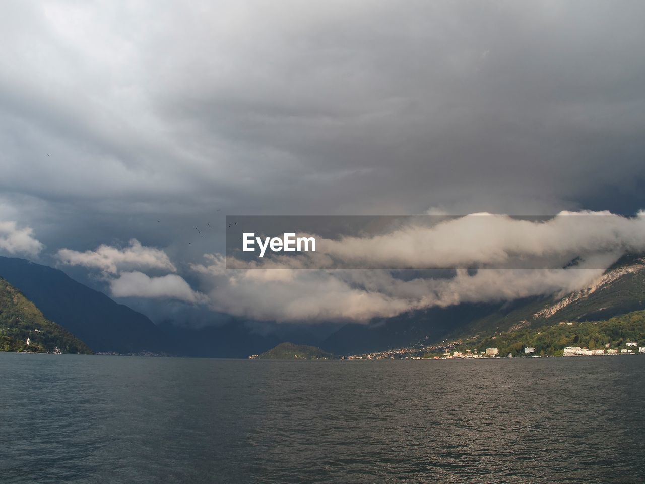 View of calm lake against mountain range