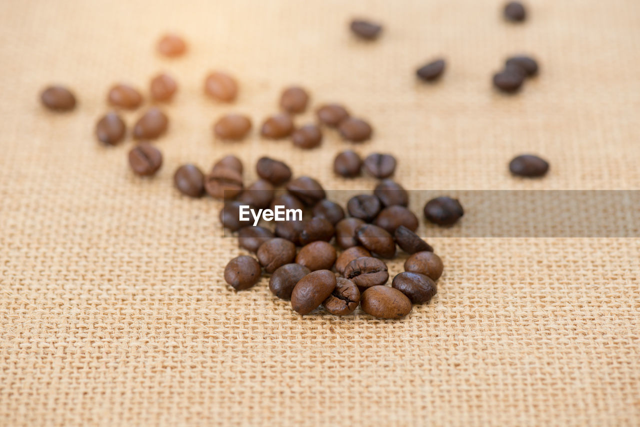 High angle view of coffee beans on burlap