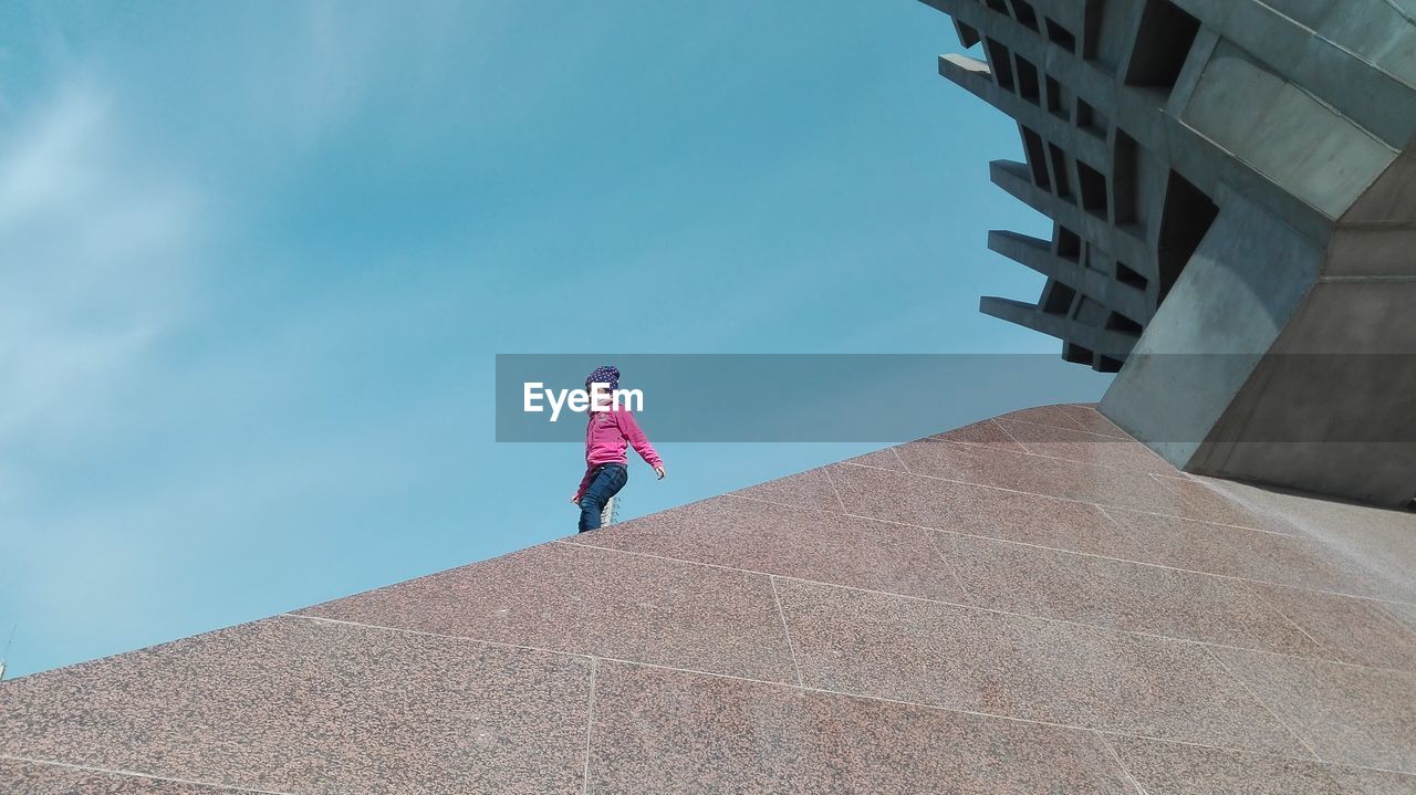 Low angle view of person against sky