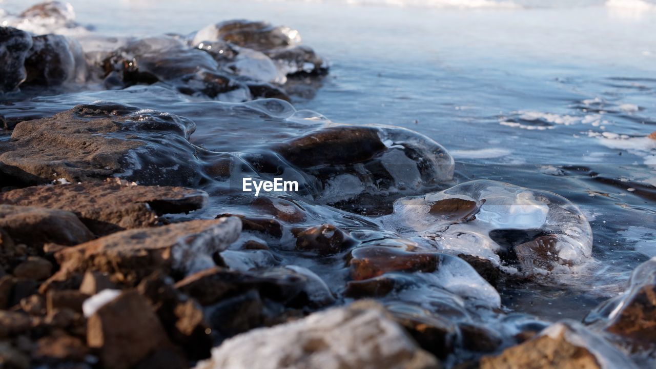 Close-up of rocks in frozen lake