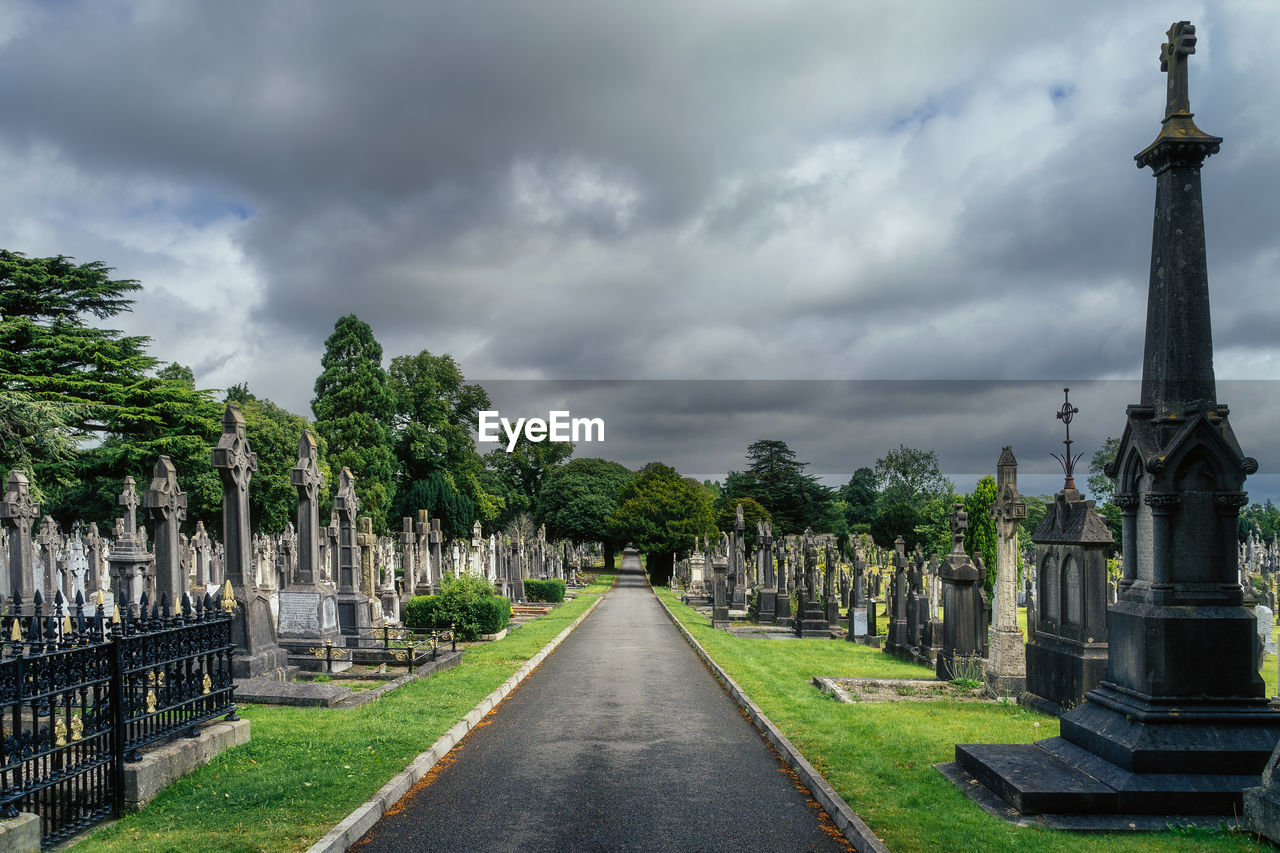 Graves with celtic crosses and sculptures in glasnevin cemetery, ireland