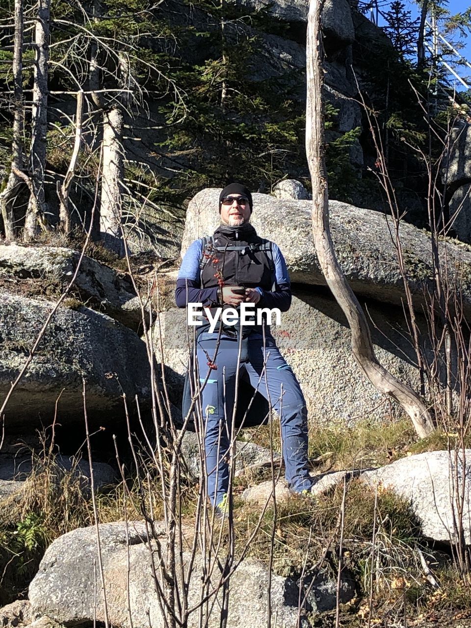 Portrait of man on rock