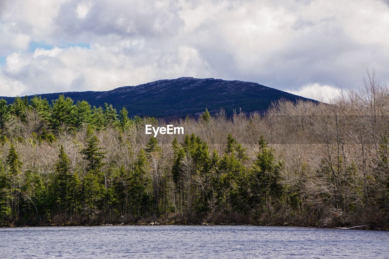 SCENIC VIEW OF MOUNTAINS AGAINST CLOUDY SKY