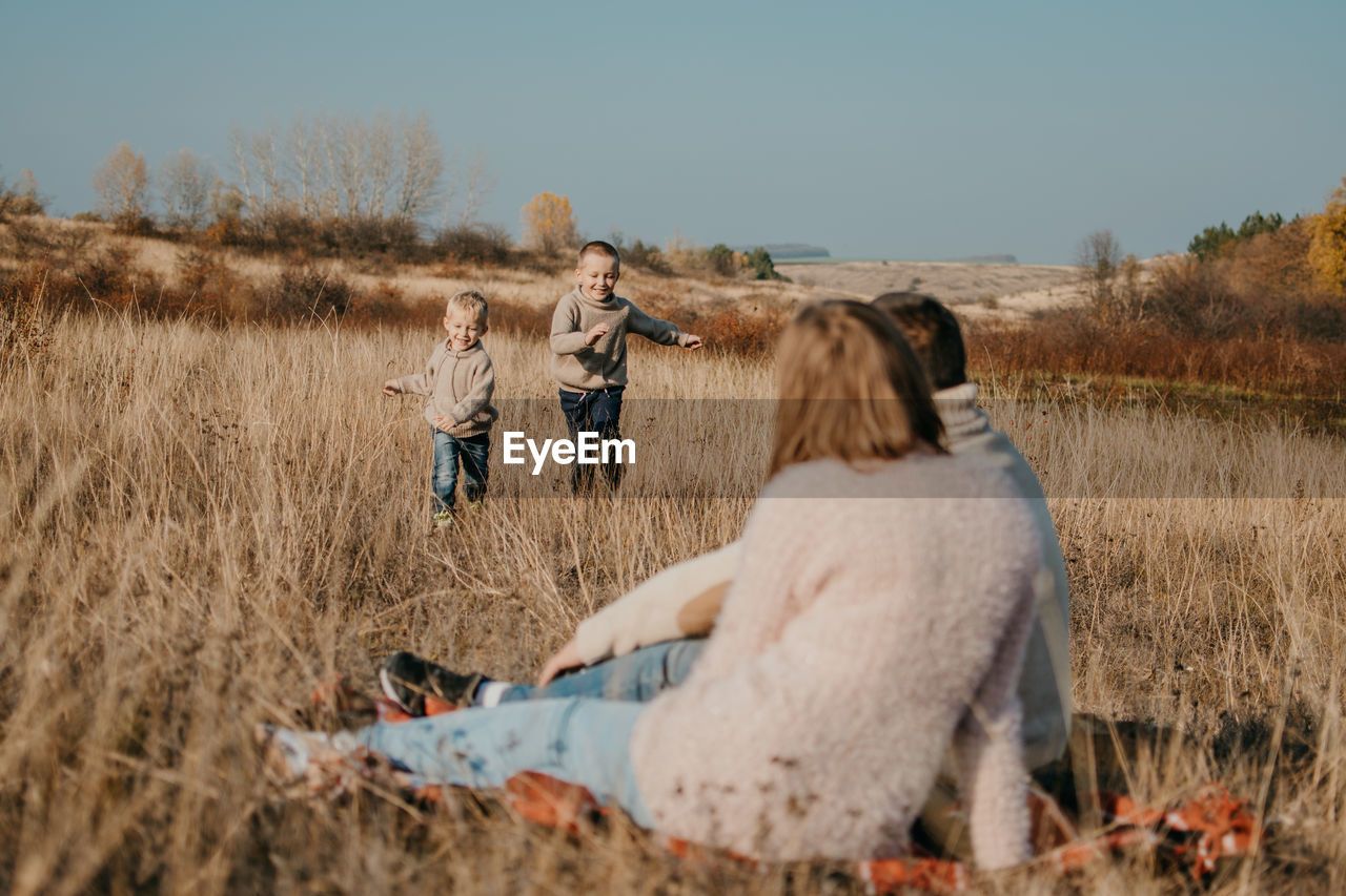 Global day of parents. happy family enjoying together on a sunny day in country. 