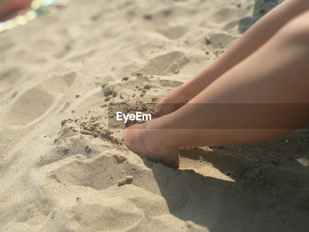 Low section of woman on beach