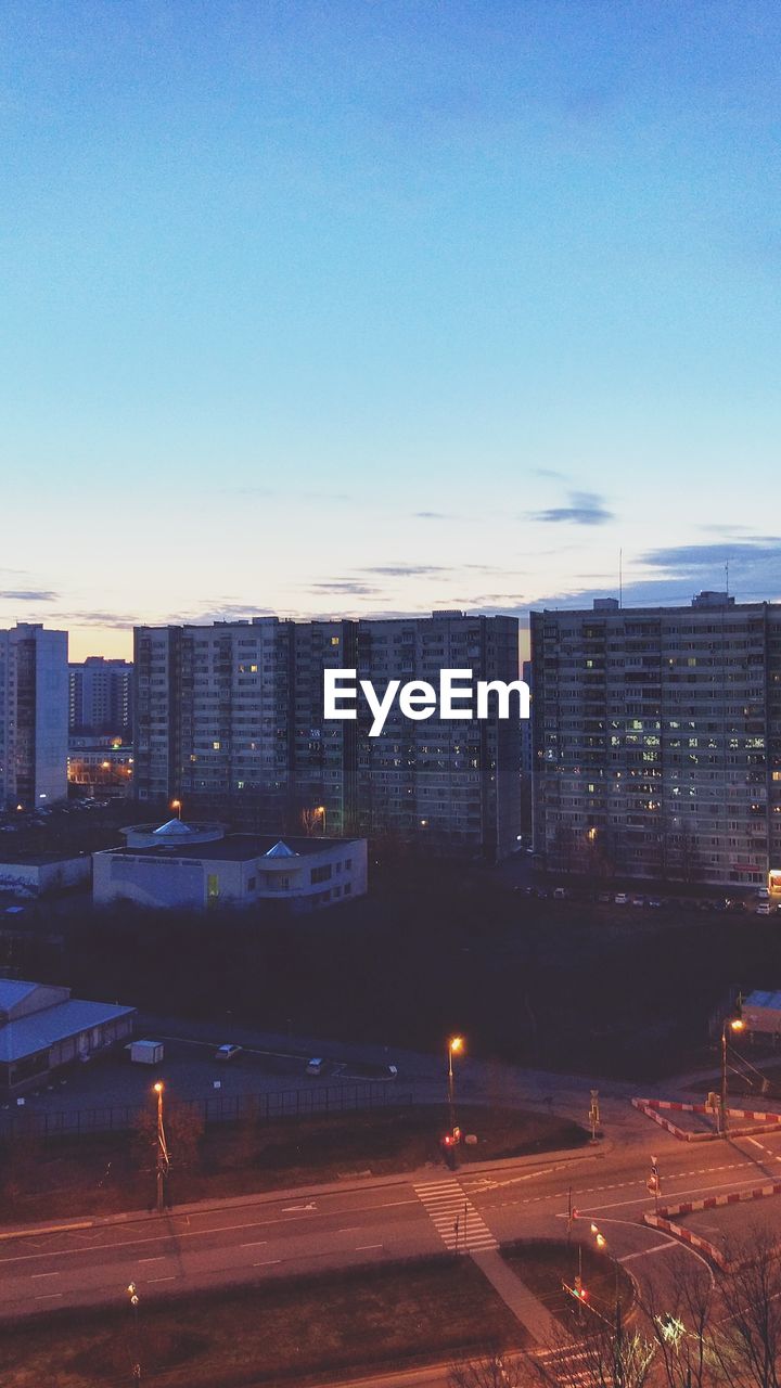 MODERN CITYSCAPE AGAINST BLUE SKY