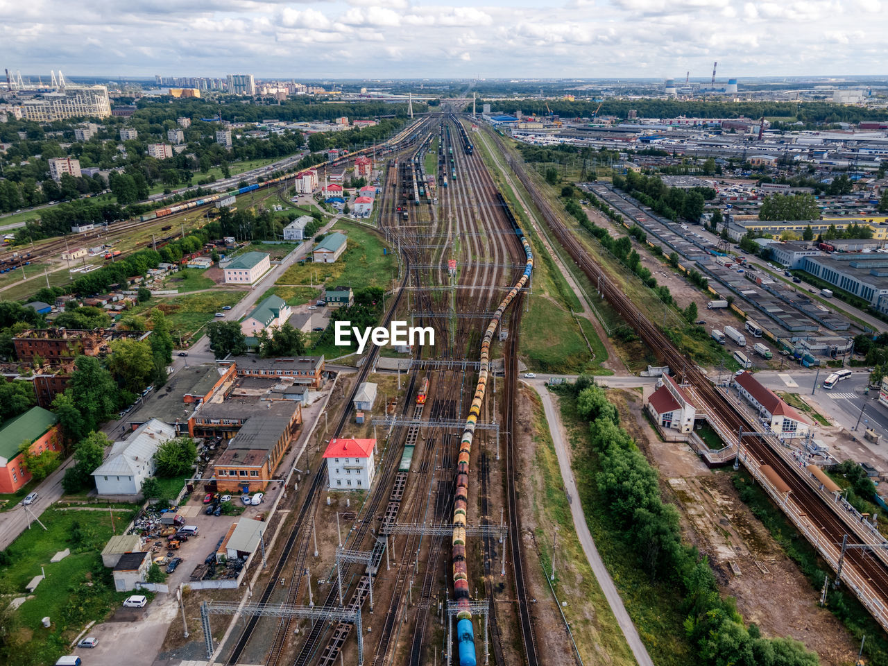 Aerial view of railways. train with cargo. sorting station. freight wagons with goods on railroad.