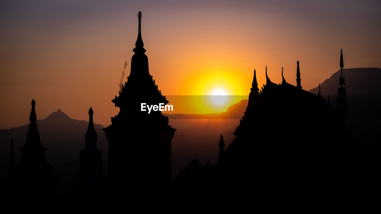 SILHOUETTE OF TEMPLE DURING SUNSET