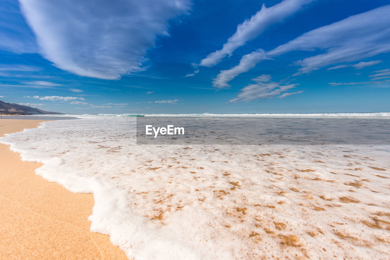 Scenic view of beach against sky