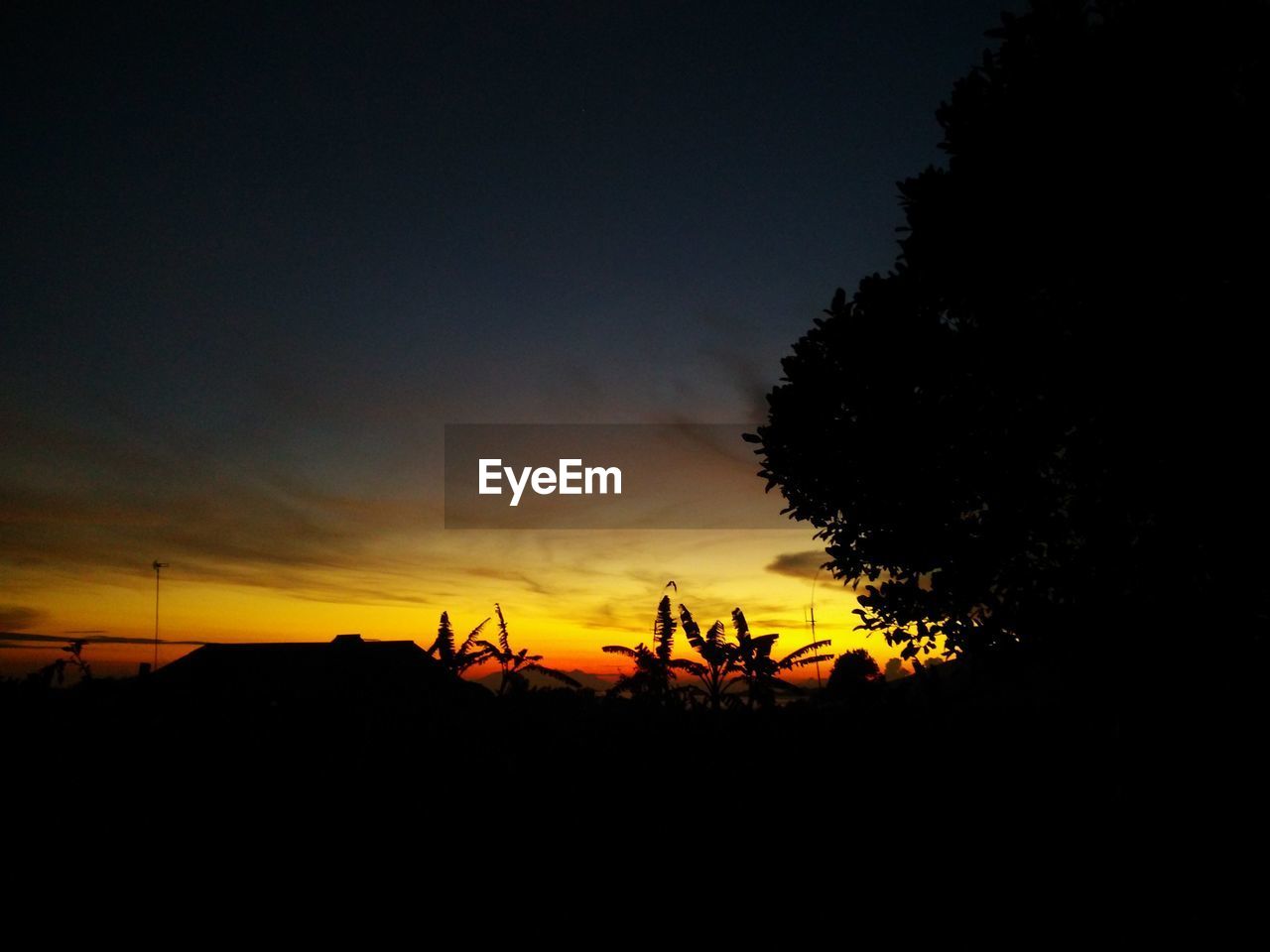 SILHOUETTE OF LANDSCAPE AGAINST SKY DURING SUNSET