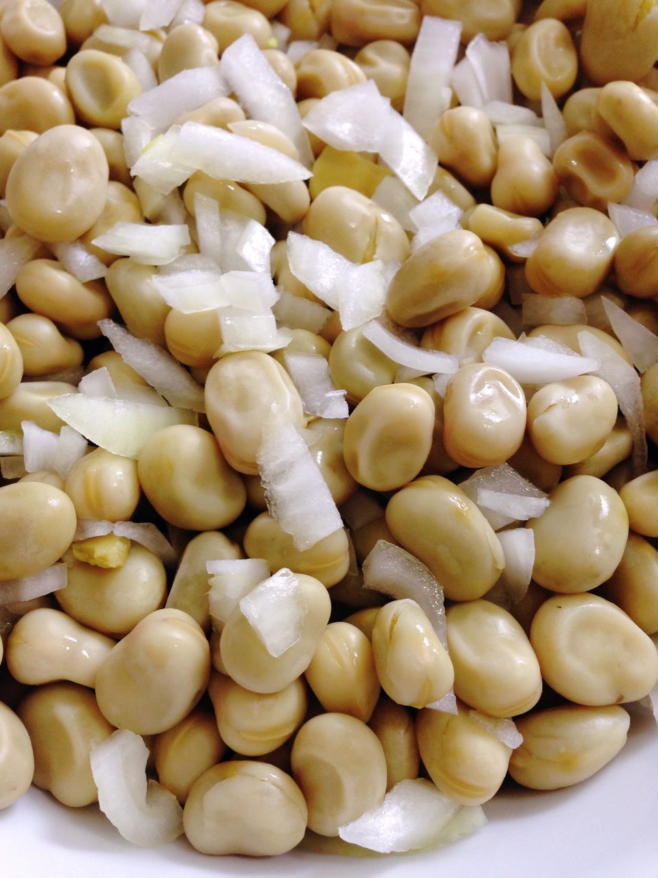 Close-up of serving boiled broad beans in bowl