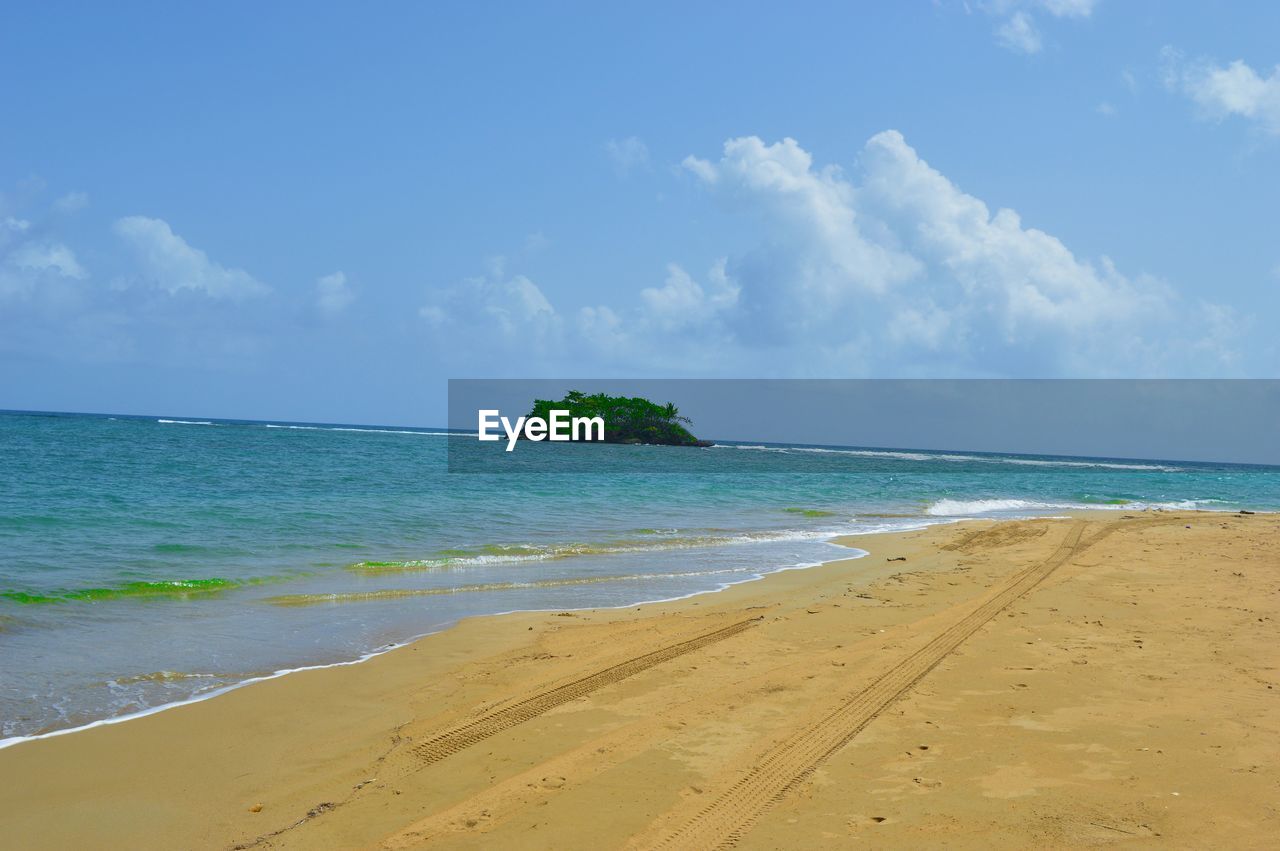 VIEW OF CALM BLUE SEA AGAINST THE SKY