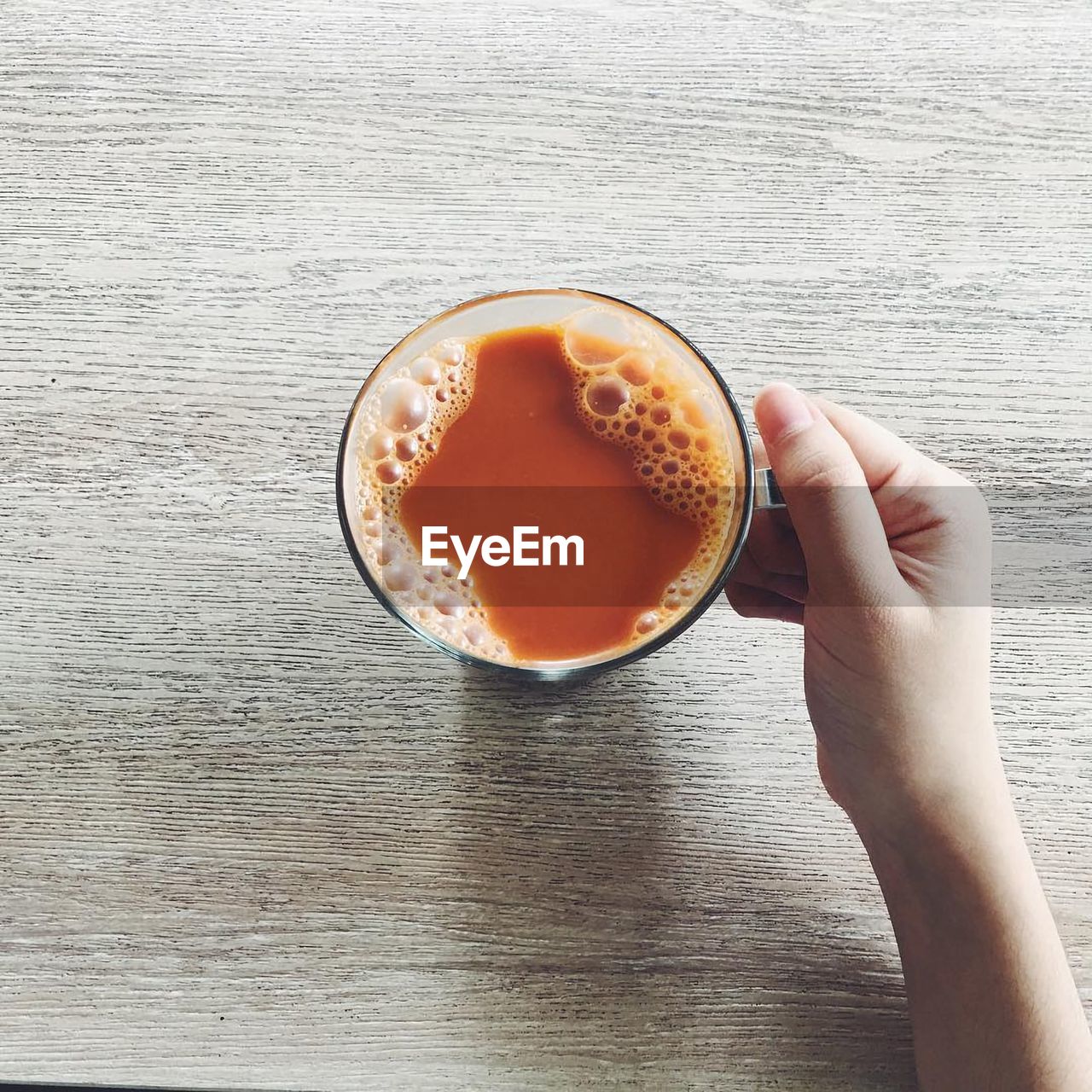 DIRECTLY ABOVE SHOT OF COFFEE CUP AND DRINK ON TABLE