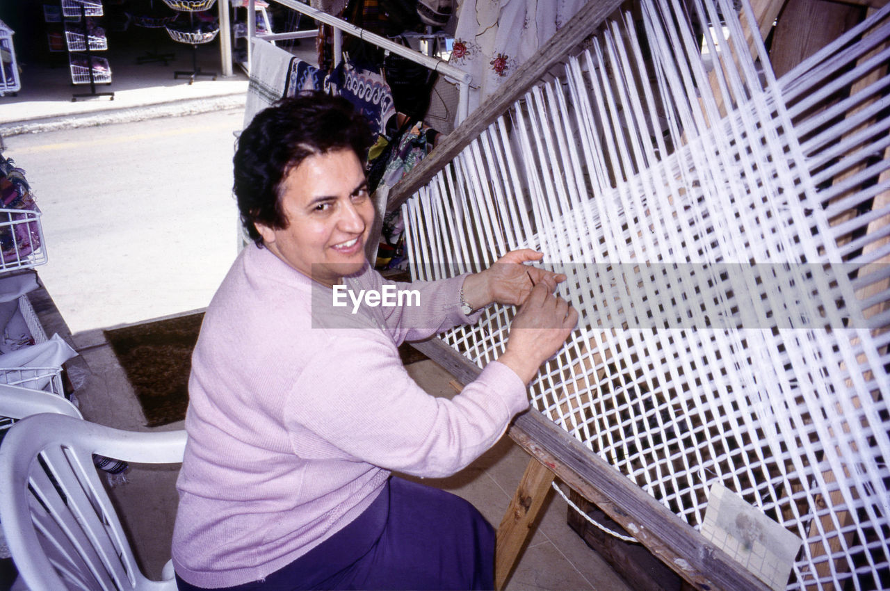 HIGH ANGLE VIEW OF SMILING MAN