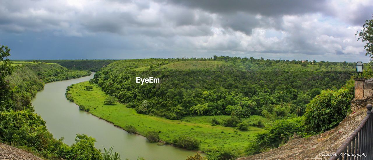 Scenic view of landscape against cloudy sky