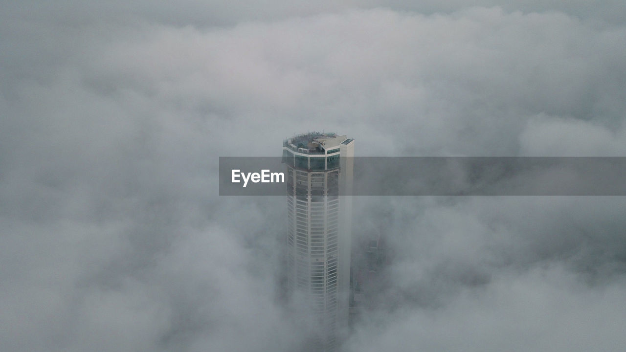 Penang komtar tower above low clouds