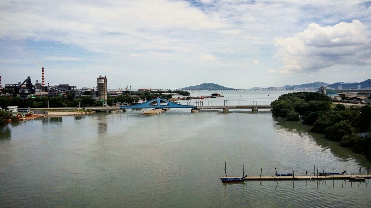 BOATS MOORED AT HARBOR