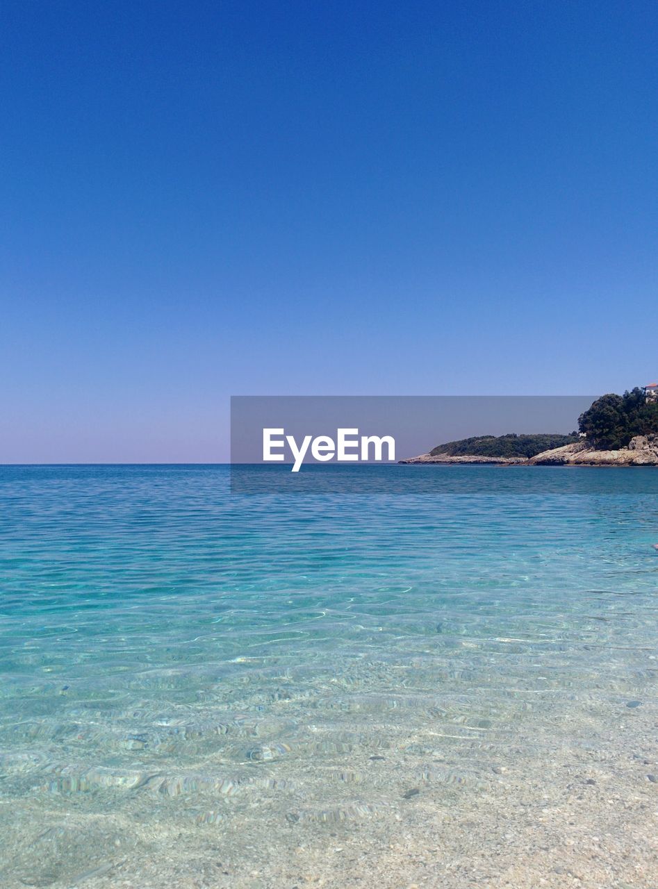 SCENIC VIEW OF BLUE SEA AGAINST CLEAR SKY