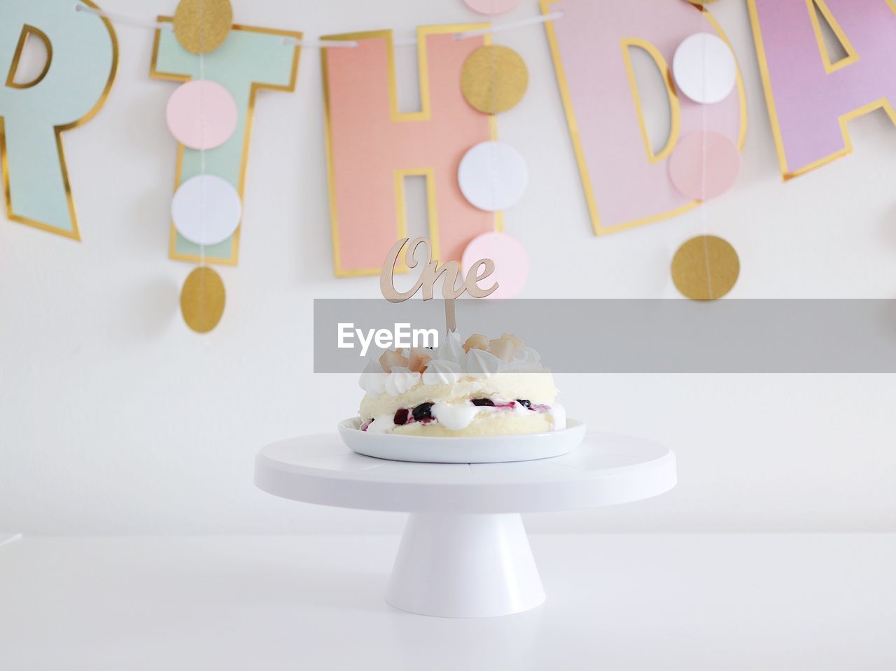 CLOSE-UP OF CAKE SERVED ON TABLE IN KITCHEN