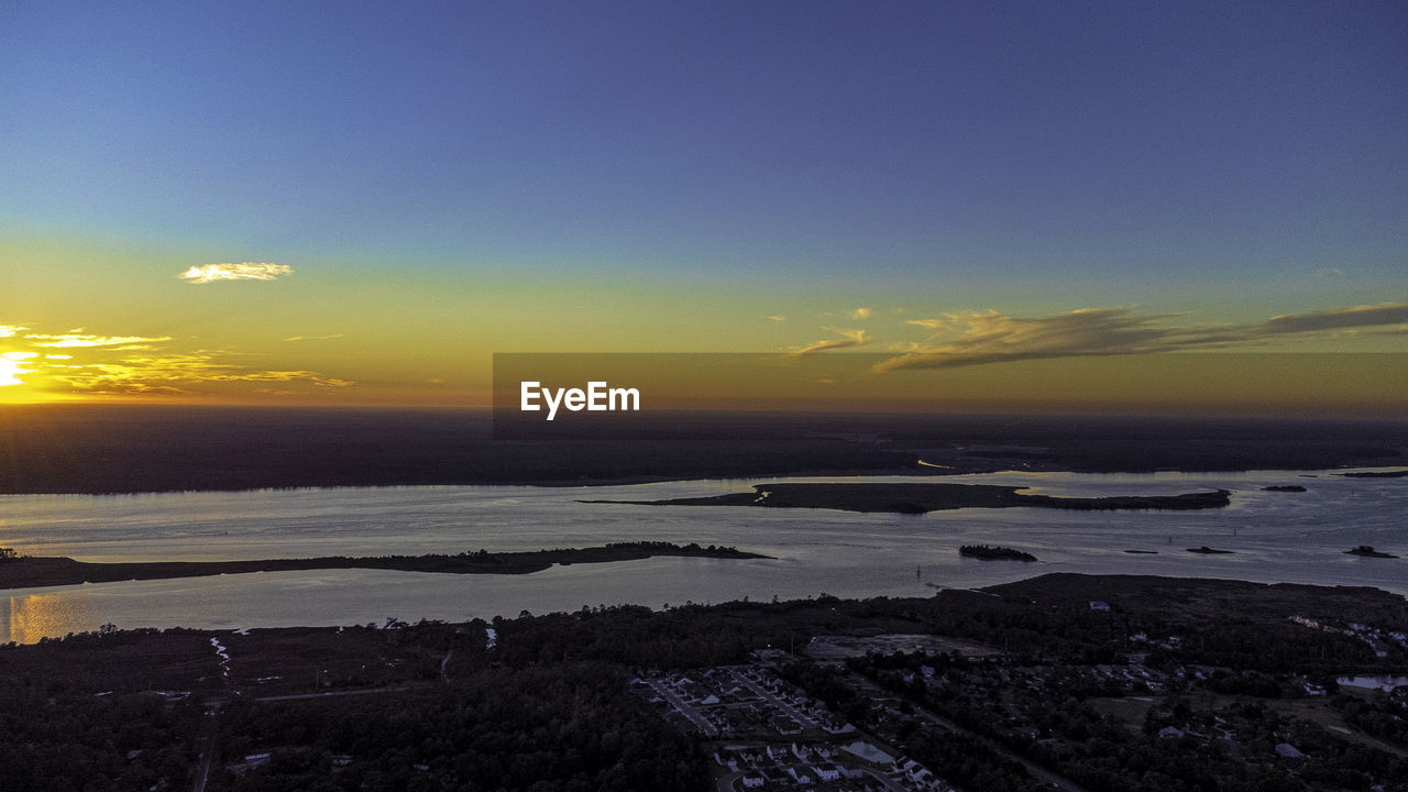 SCENIC VIEW OF SEA DURING SUNSET