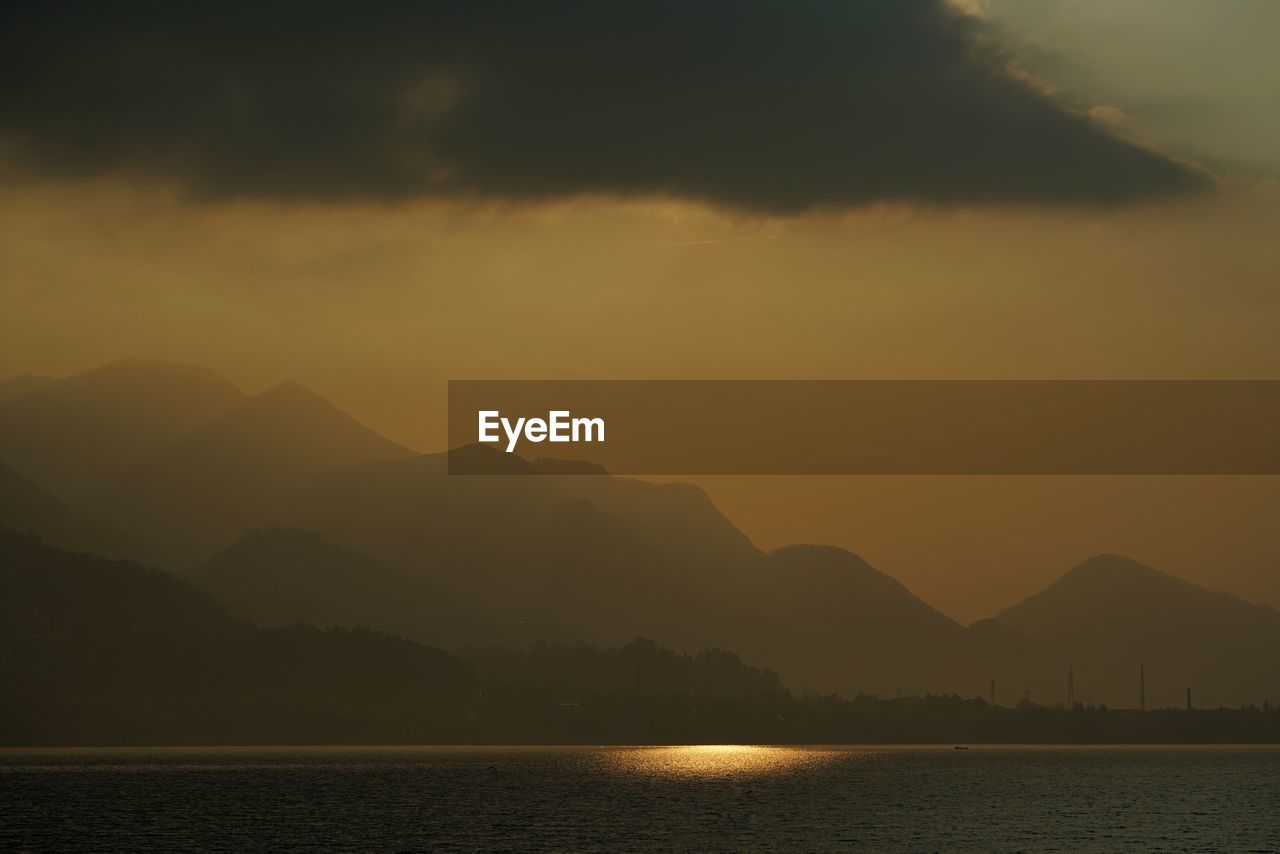 Scenic view of mountains against sky during sunset