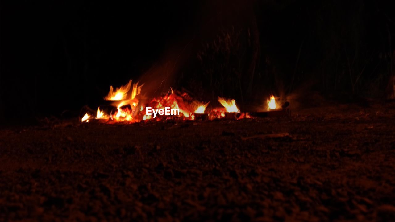 BONFIRE ON WOODEN FIRE IN THE DARK