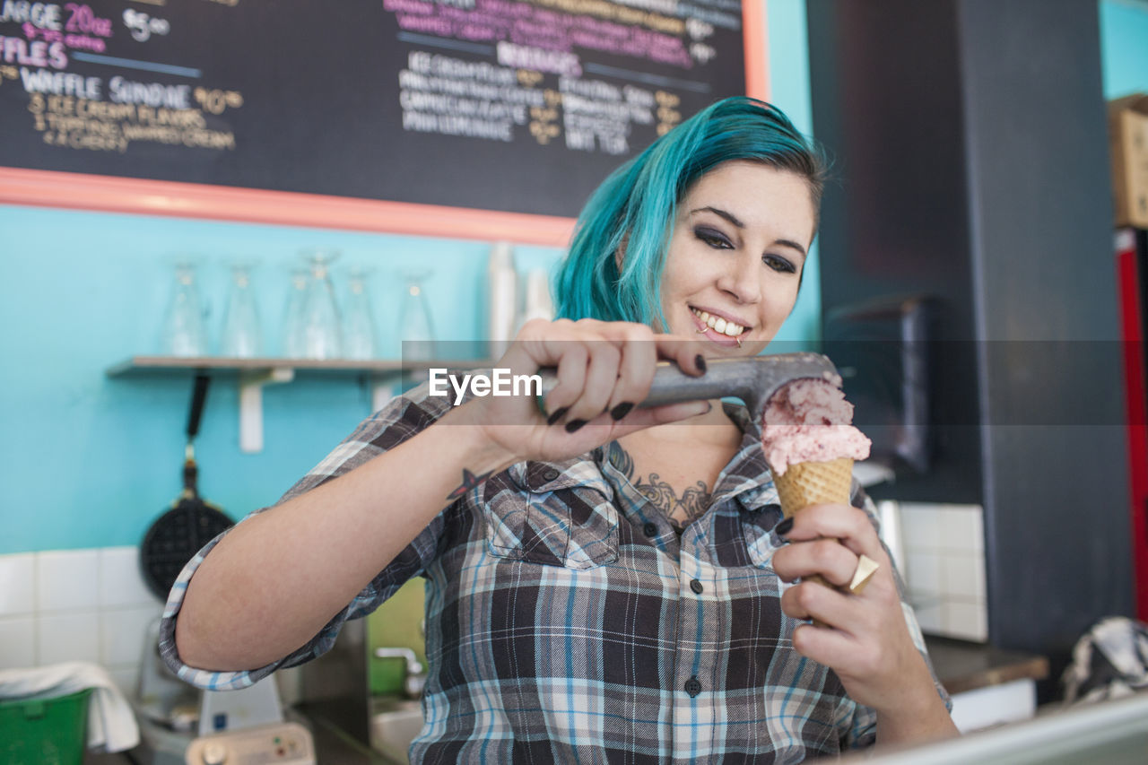 Woman making ice cream at store