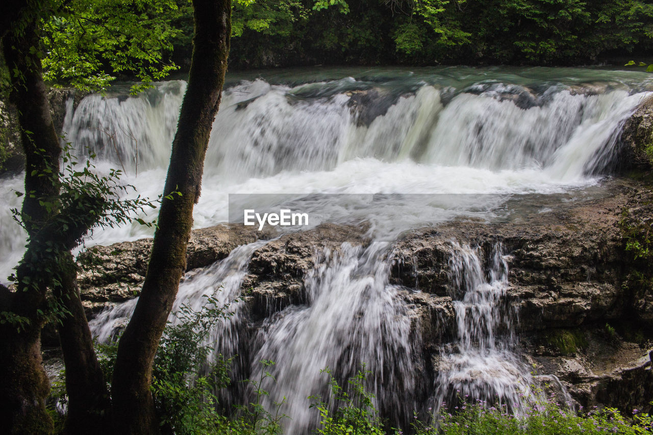 SCENIC VIEW OF WATERFALL