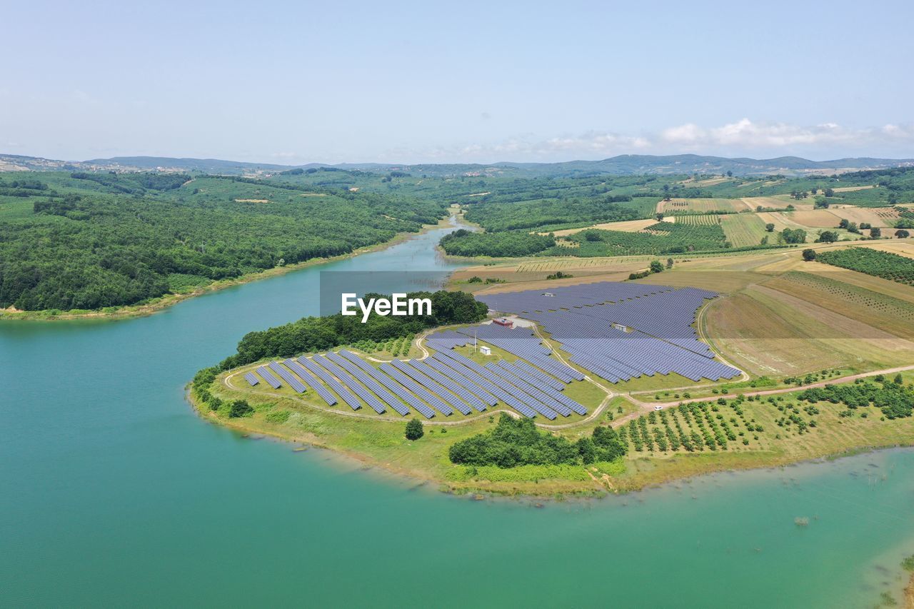 AERIAL VIEW OF RIVER AMIDST FIELD