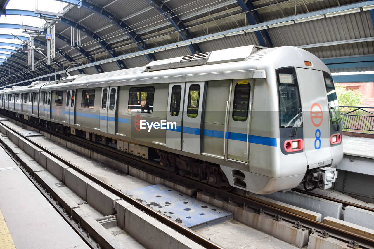 Delhi metro train arriving at jhandewalan metro station in new delhi, india, asia, public metro rail