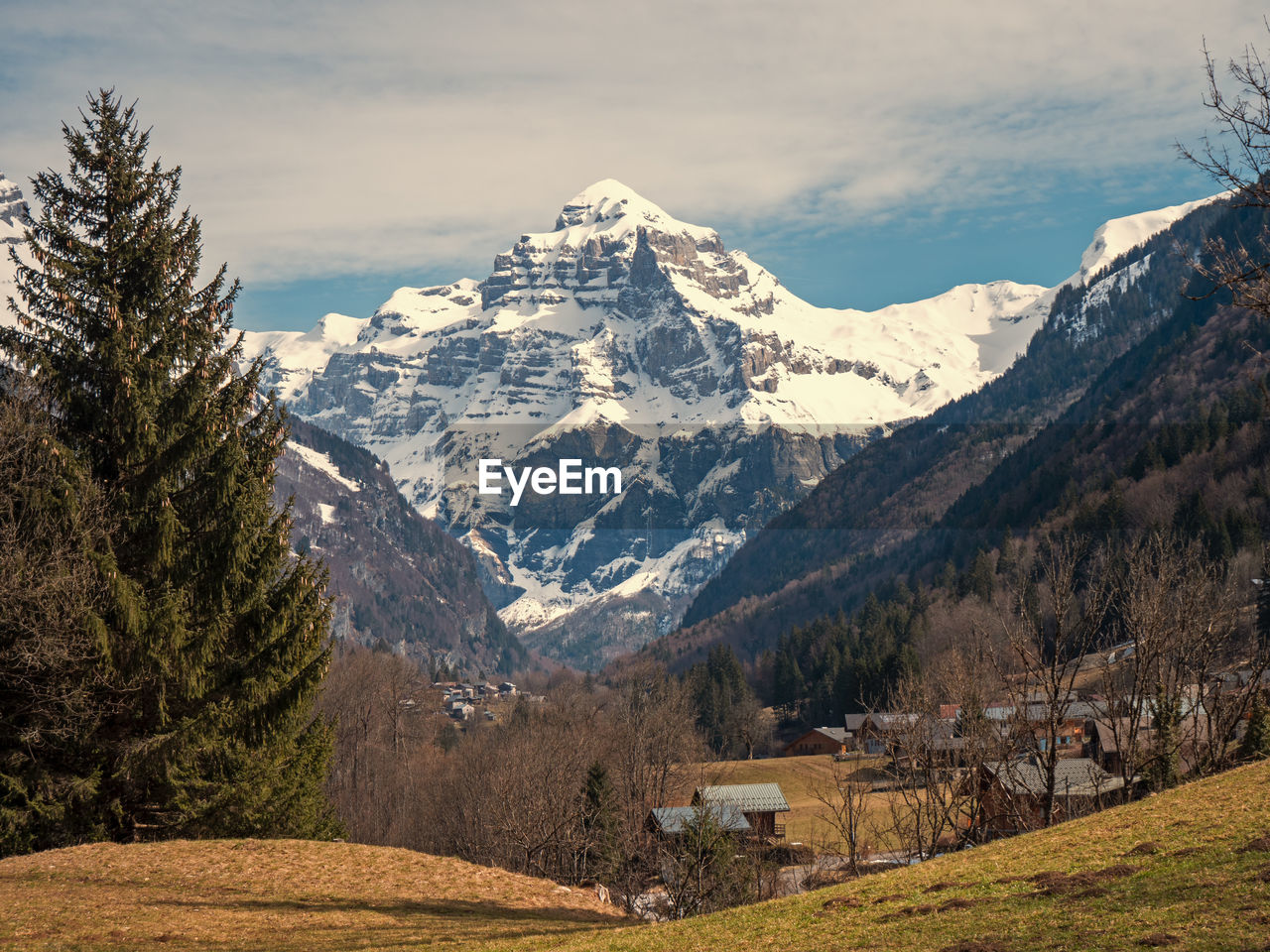 Scenic view of snowcapped mountains against sky