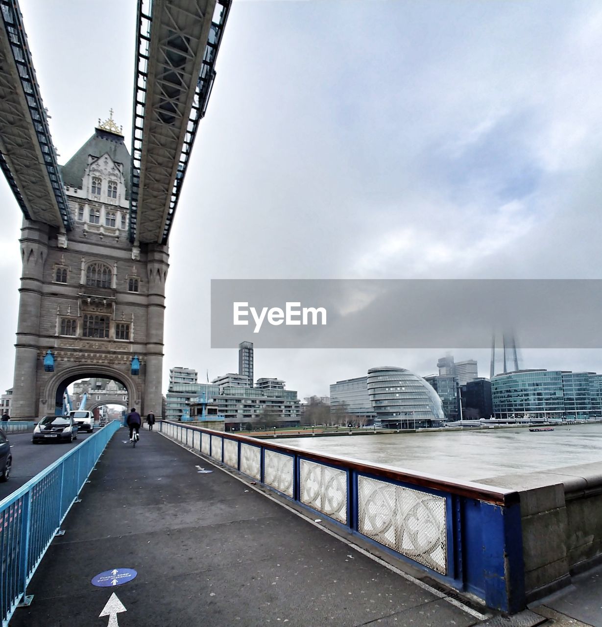 VIEW OF BRIDGE AND BUILDINGS AGAINST SKY