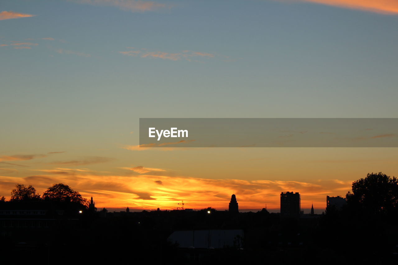 SILHOUETTE OF CITY AT SUNSET