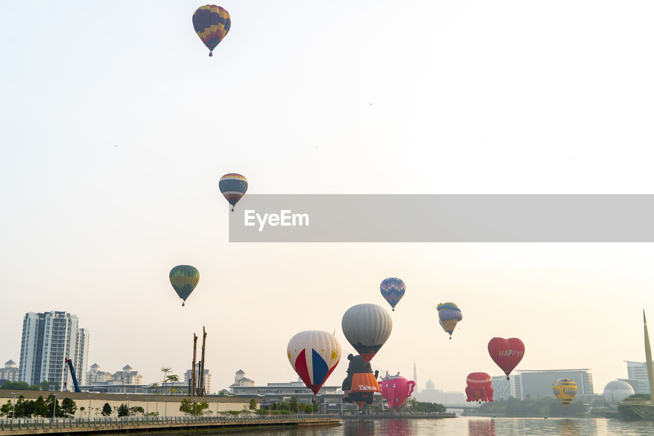 HOT AIR BALLOONS FLYING AGAINST SKY