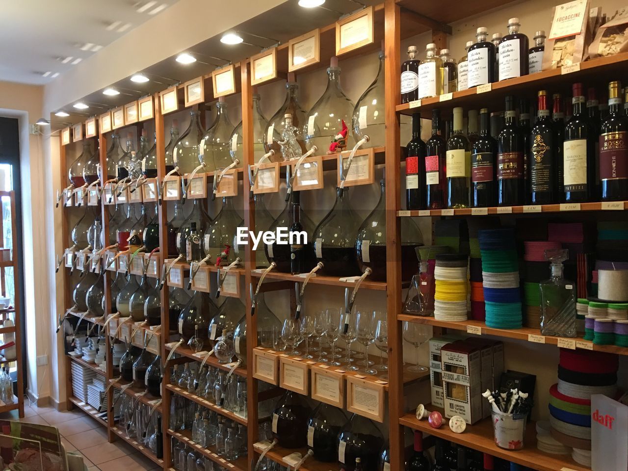 VIEW OF BOTTLES IN SHELF